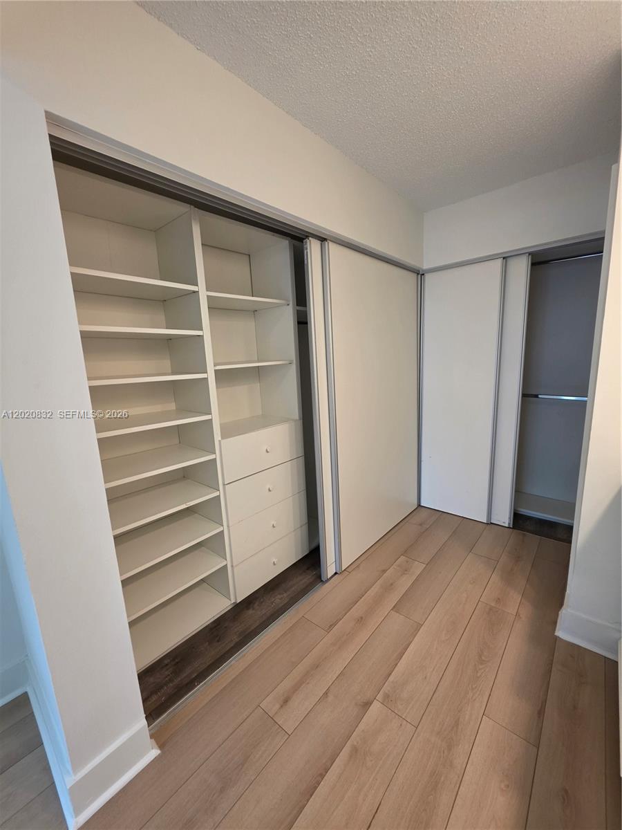 15240 Southwest 45th Terrace, Unit 54F Miami, FL 33185 - Photo 34 of 48 a view of an empty walk in closet
