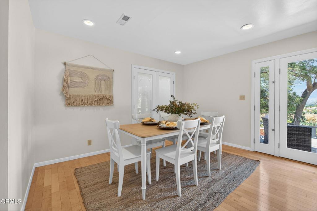 98 Howard Avenue Oak View, CA 93022 - Photo 21 of 72 a view of a dining room with furniture and wooden floor