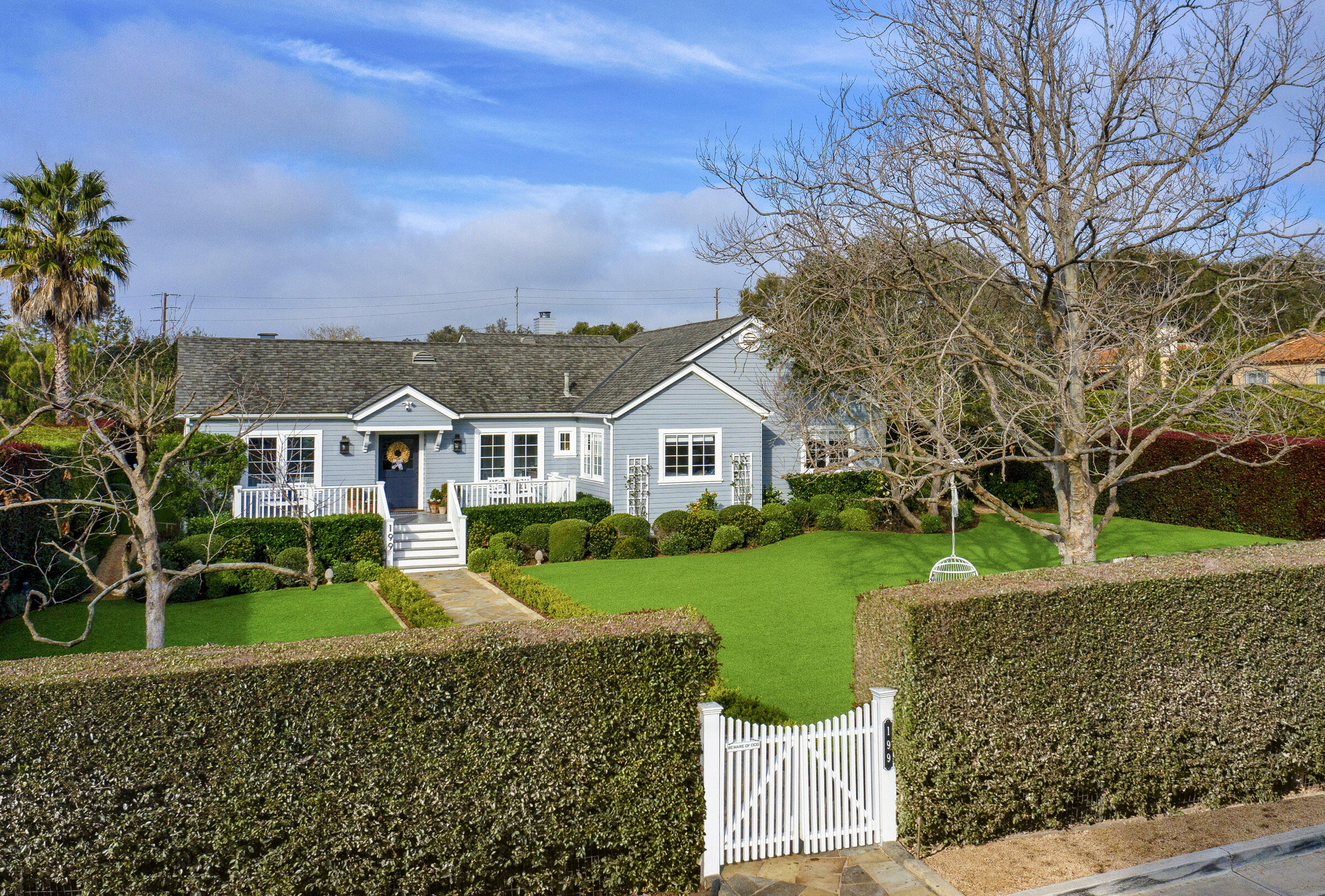 199 Ocean View Avenue Carpinteria, CA 93013 - Photo 1 of 22 a front view of a house with a yard