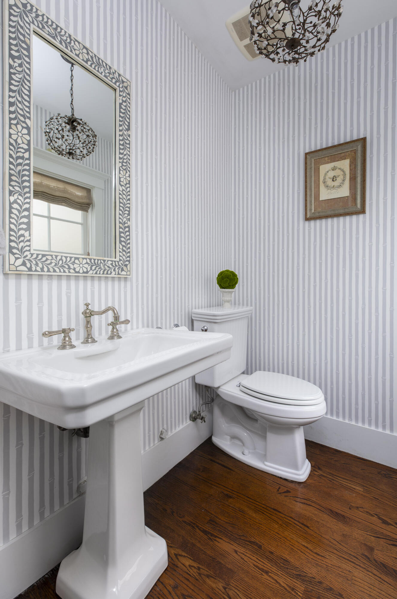 199 Ocean View Avenue Carpinteria, CA 93013 - Photo 17 of 22 a bathroom with a toilet a sink and mirror