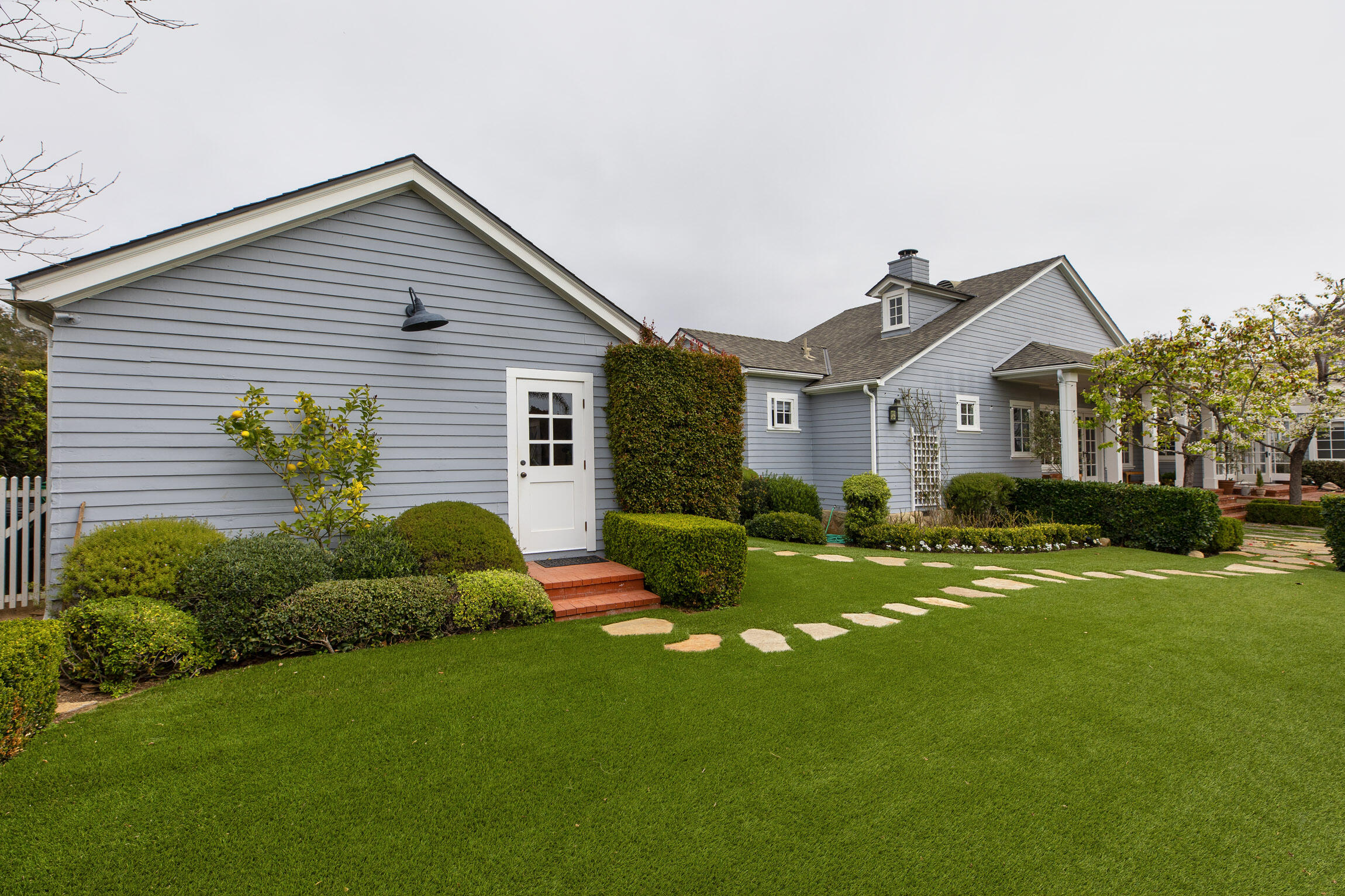 199 Ocean View Avenue Carpinteria, CA 93013 - Photo 20 of 22 a front view of house with yard and green space