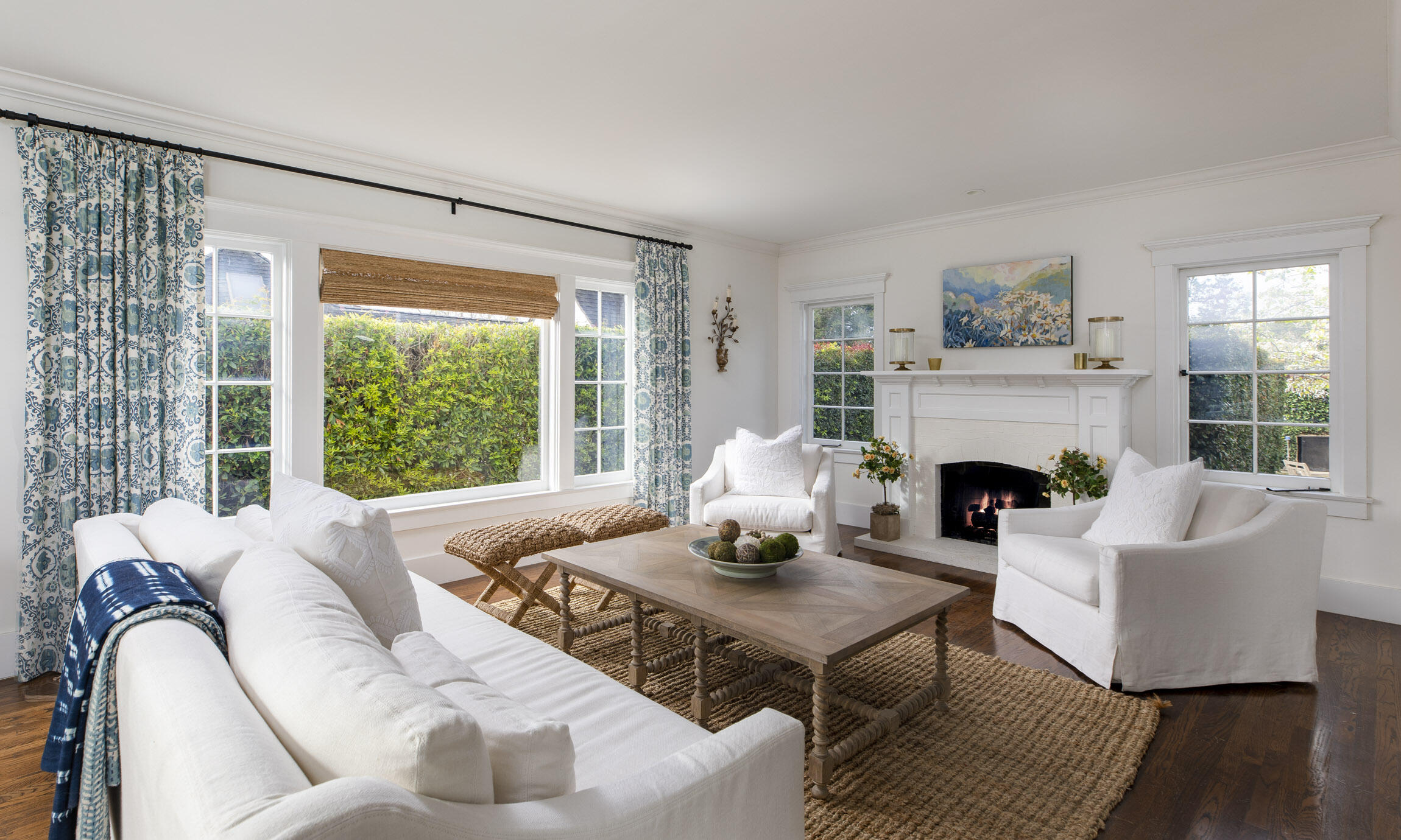 199 Ocean View Avenue Carpinteria, CA 93013 - Photo 2 of 22 a living room with furniture fireplace and a table