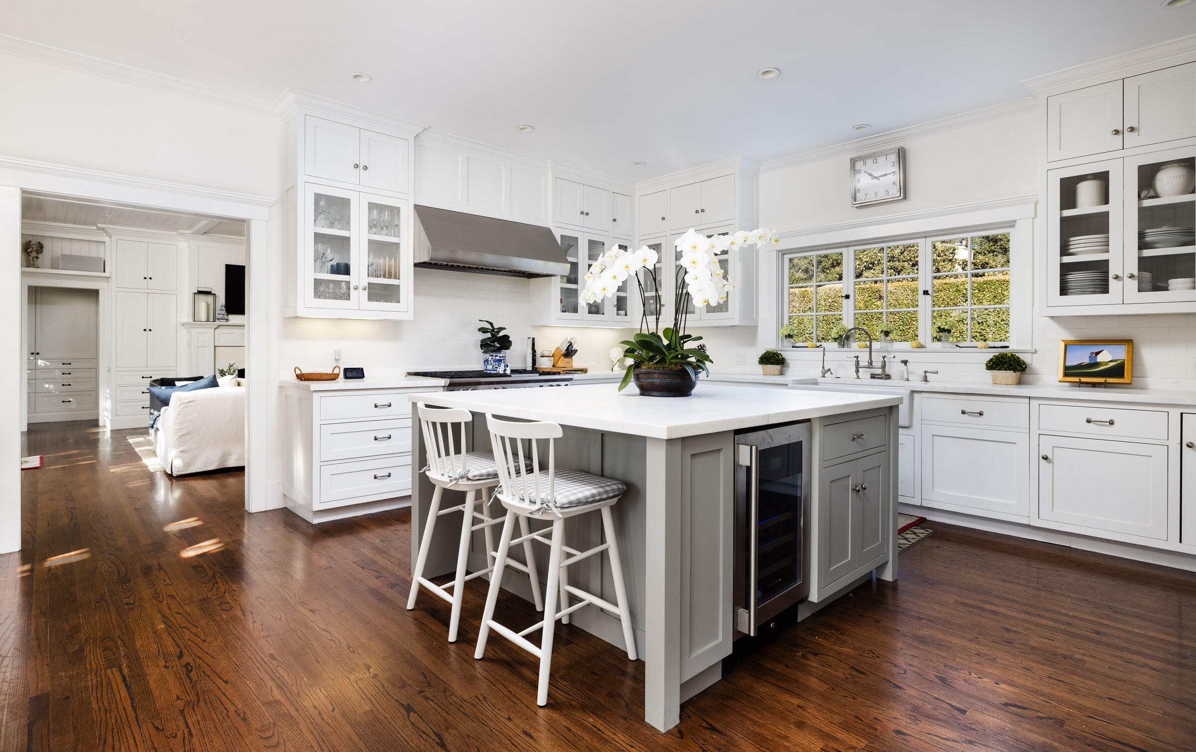 199 Ocean View Avenue Carpinteria, CA 93013 - Photo 4 of 22 a kitchen with stainless steel appliances a white stove top oven and a wooden floors