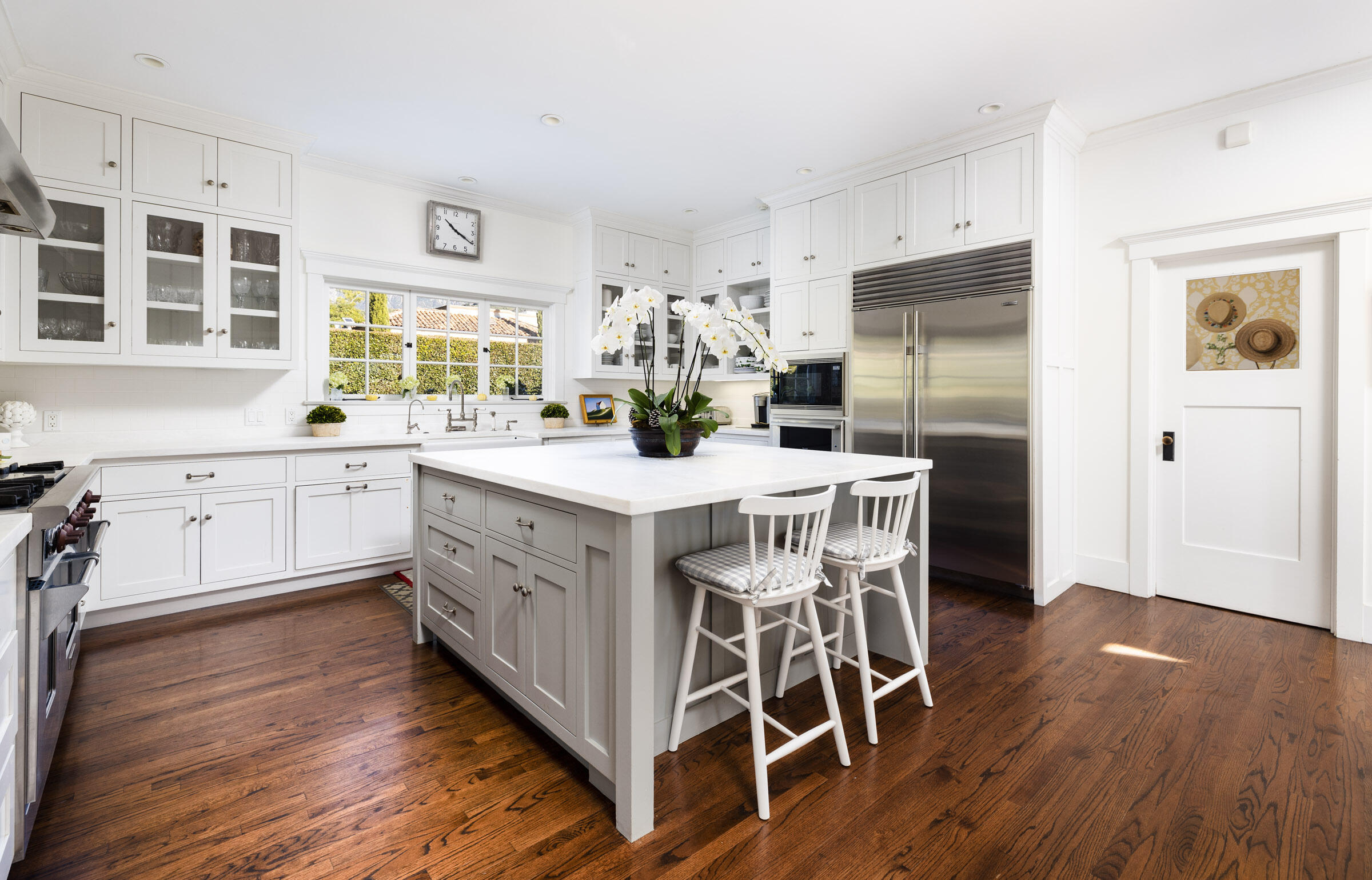 199 Ocean View Avenue Carpinteria, CA 93013 - Photo 5 of 22 a kitchen with stainless steel appliances a table chairs refrigerator and sink