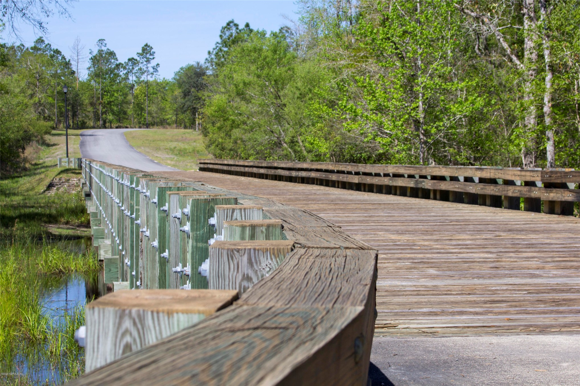 15433 Bullock Bluff Road Bryceville, FL 32009 - Photo 14 of 17 a view of a balcony with lake view and wooden floor