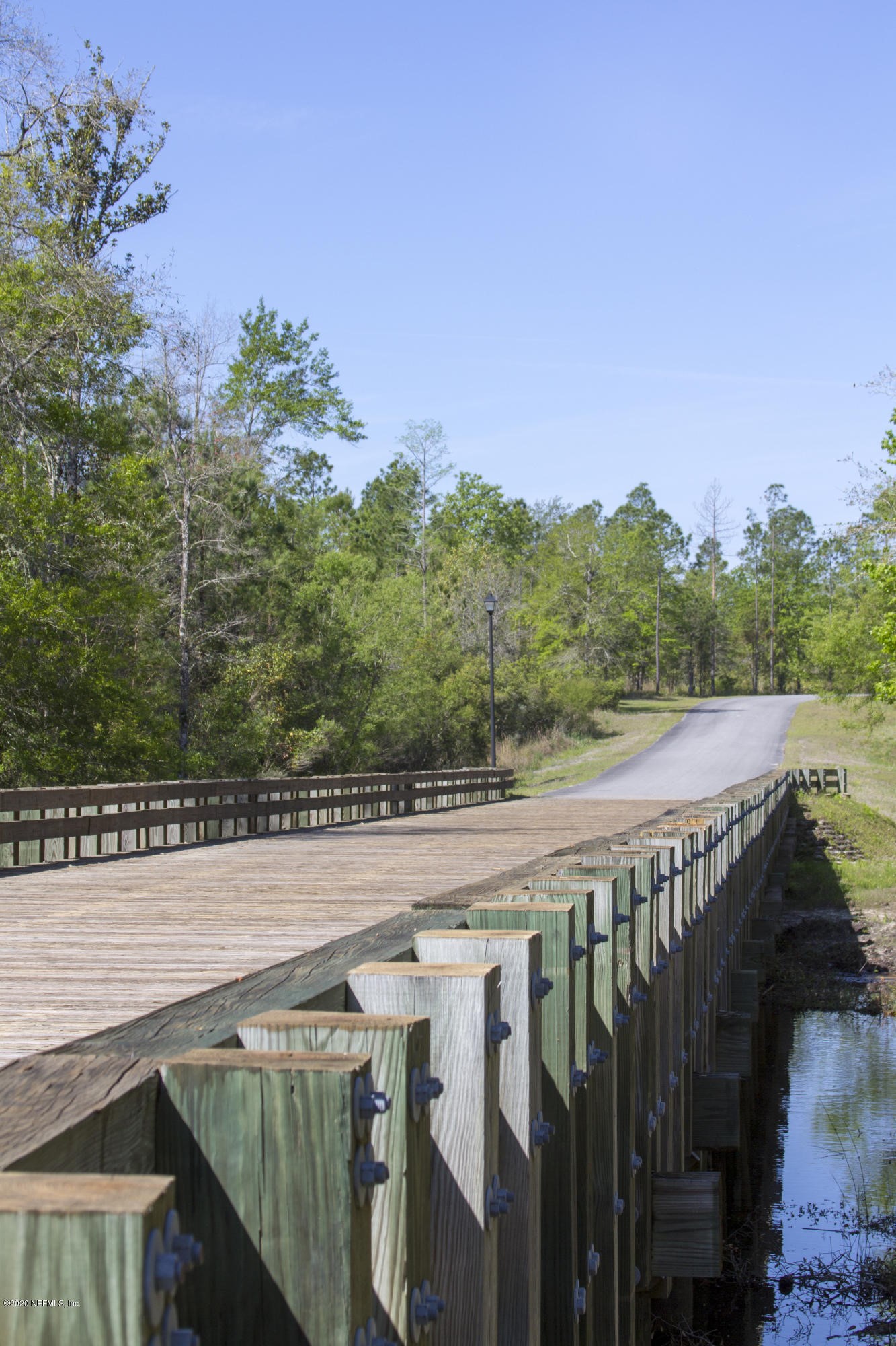 15433 Bullock Bluff Road Bryceville, FL 32009 - Photo 15 of 17 a view of a balcony with wooden floor and fence