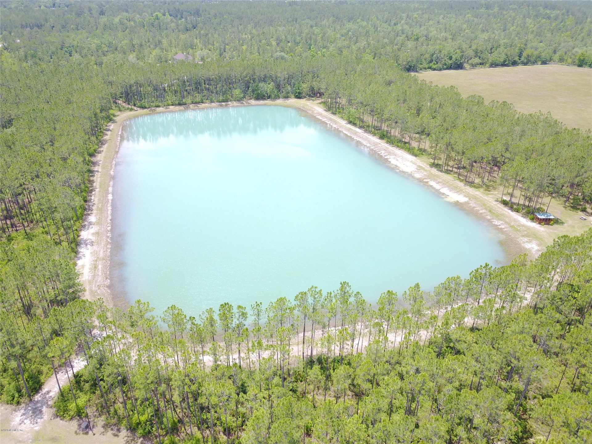 15433 Bullock Bluff Road Bryceville, FL 32009 - Photo 8 of 17 a view of a yard and lake