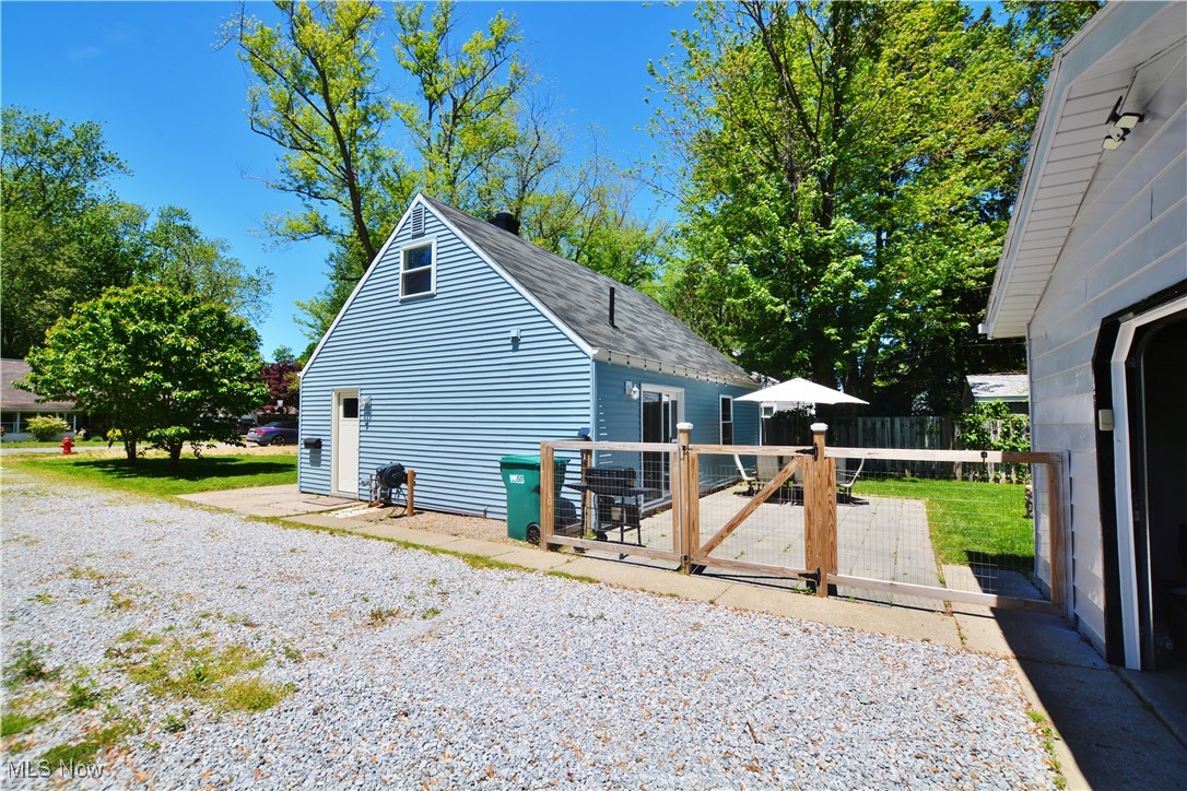 1795 Aberdeen Road Madison, OH 44057 - Photo 3 of 24 View of property exterior with a deck and a shingled roof