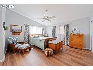 845 Northwest 3rd Street Gresham, OR 97030 - Photo 13 of 32 a bedroom with a bed and a chandelier