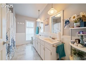 845 Northwest 3rd Street Gresham, OR 97030 - Photo 17 of 32 a bathroom with a sink and a mirror
