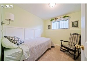 845 Northwest 3rd Street Gresham, OR 97030 - Photo 19 of 32 a bedroom with a bed and a chair