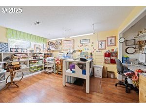 845 Northwest 3rd Street Gresham, OR 97030 - Photo 20 of 32 a living room with lots of furniture and clutter