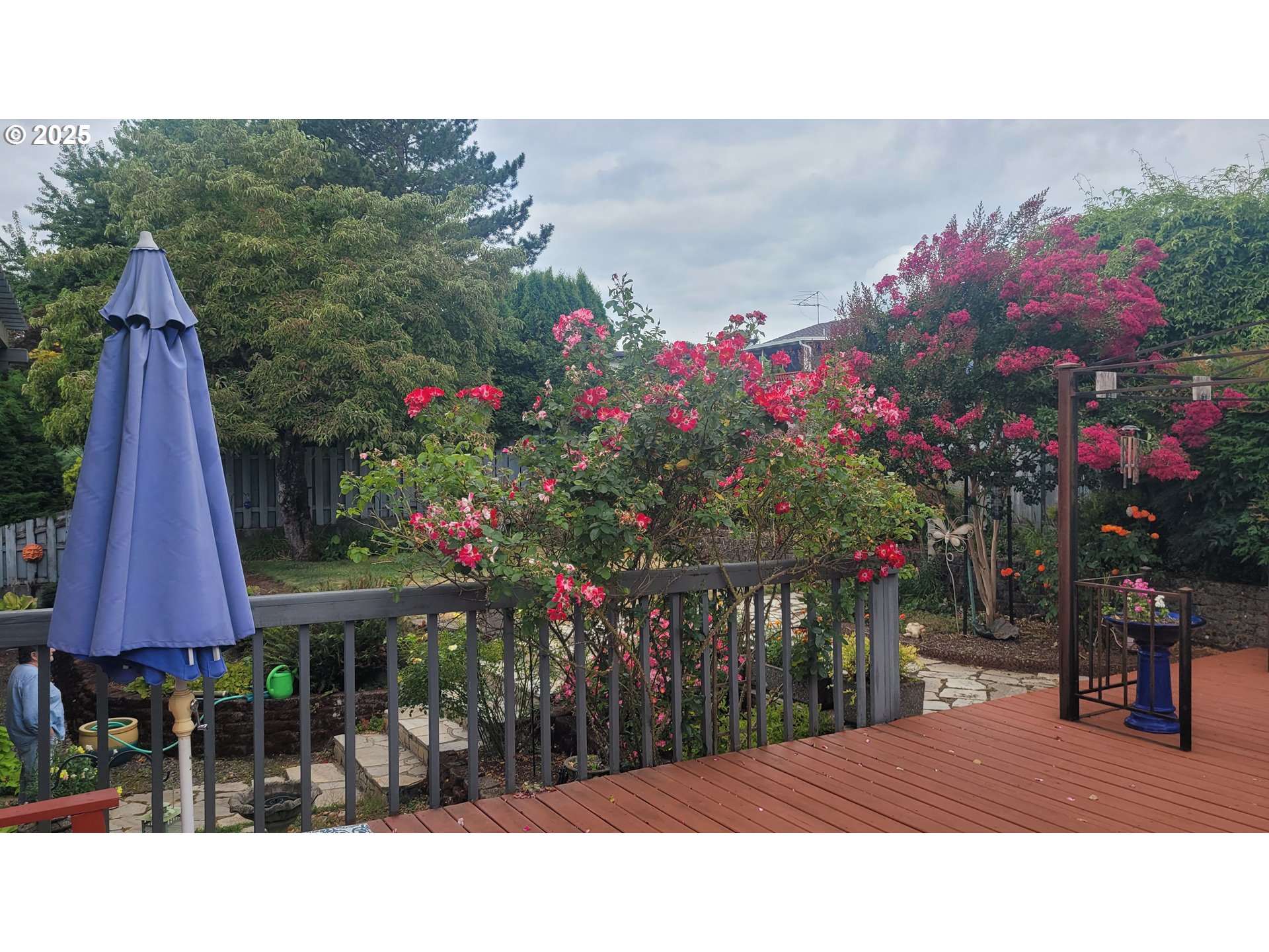845 Northwest 3rd Street Gresham, OR 97030 - Photo 27 of 32 a couple of people sitting in a yard in front of a house