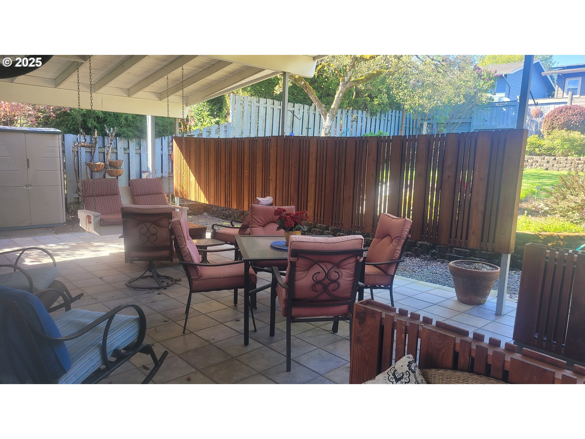 845 Northwest 3rd Street Gresham, OR 97030 - Photo 31 of 32 a backyard of a house with table and chairs