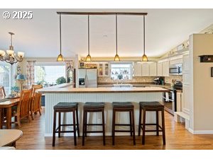 845 Northwest 3rd Street Gresham, OR 97030 - Photo 10 of 32 a dining table with chairs and window