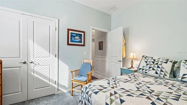 a bedroom with a bed and a cabinets