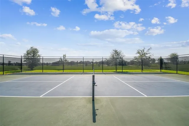 a view of an outdoor space and tennis court