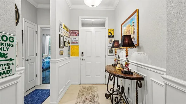 a view of a hallway with workspace and wooden floor