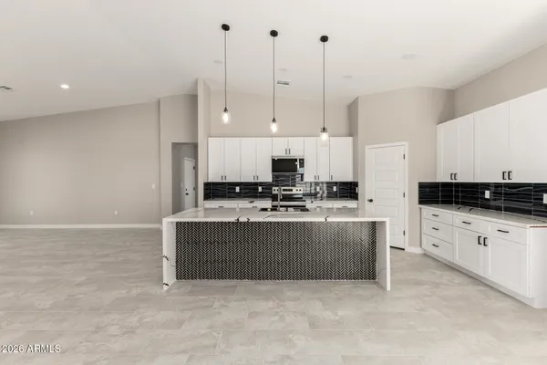 a large kitchen with cabinets