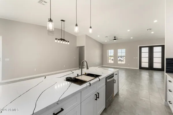 a kitchen with a sink appliances and window