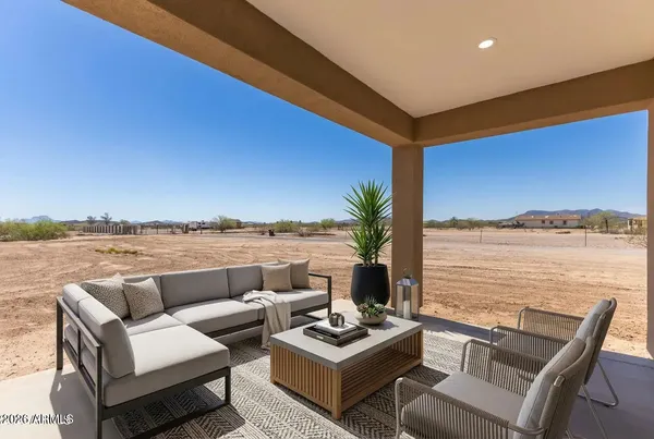 a view of living room with patio and ocean view
