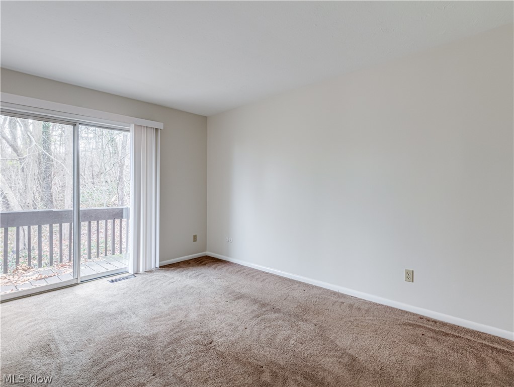 2550 Chamberlain Road, Unit A3 Akron, OH 44333 - Photo 15 of 21 Carpeted bedroom room with a wealth of natural light