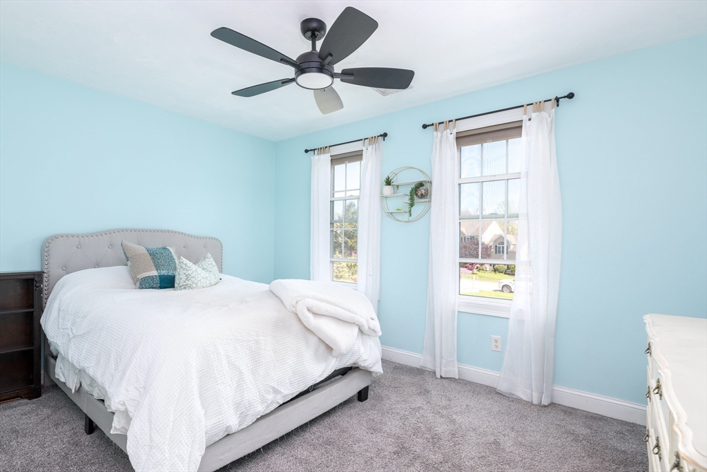 27 Vista Circle Rutland, MA 01543 - Photo 18 of 35 a bedroom with a large bed and a window