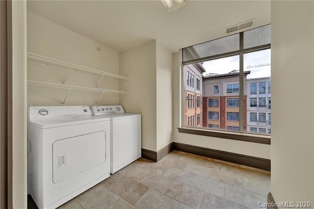 4300 Sharon Road, Unit 302 Charlotte, NC 28211 - Photo 8 of 10 a utility room with dryer and washer