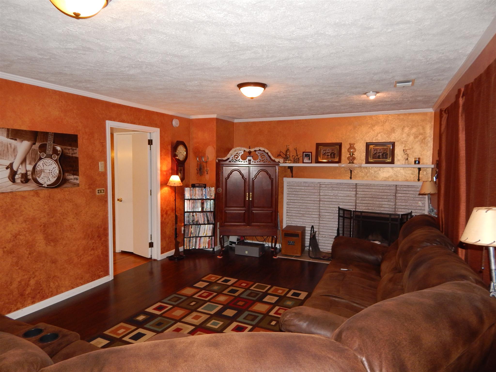3617 Academy Road Portland, TN 37148 - Photo 12 of 27 a living room with furniture and a fireplace