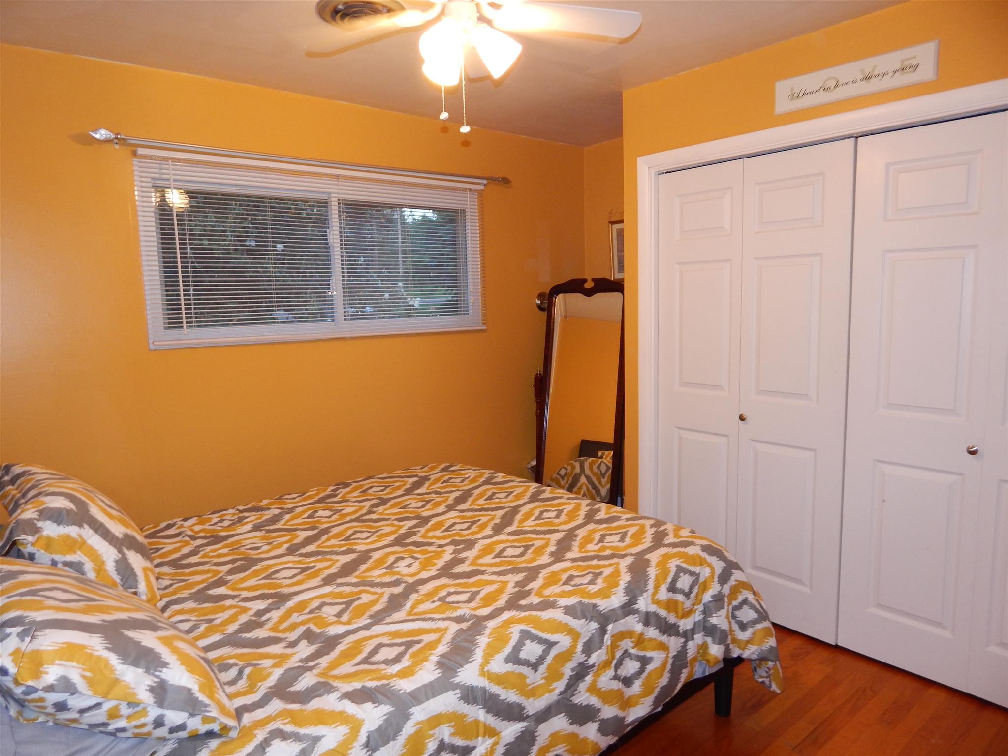 3617 Academy Road Portland, TN 37148 - Photo 19 of 27 a bedroom with a bed and wooden floor