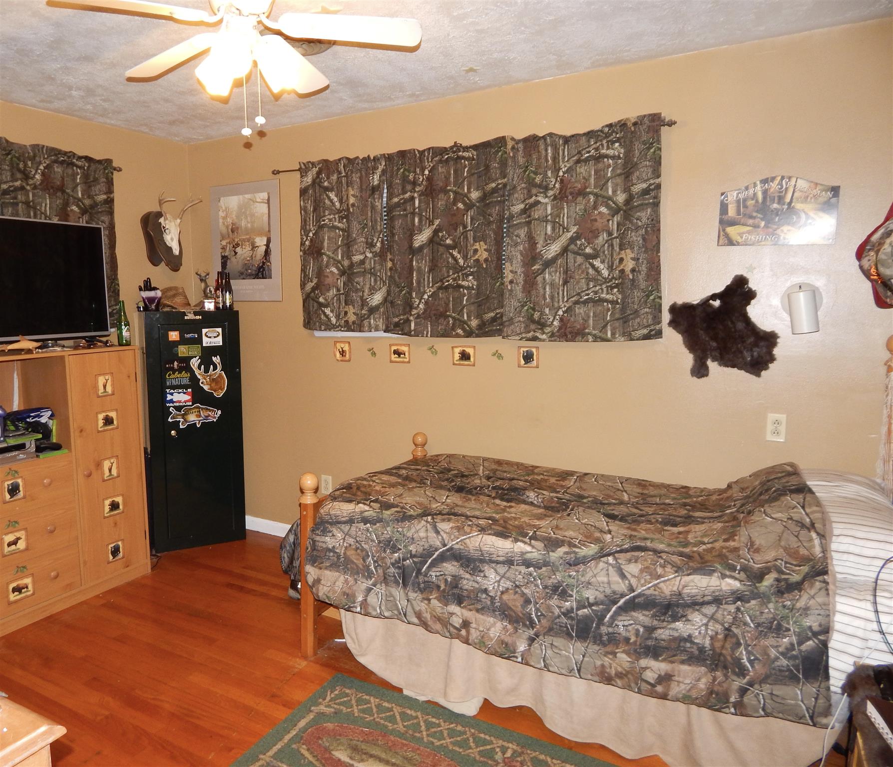 3617 Academy Road Portland, TN 37148 - Photo 23 of 27 a bedroom with a bed and a television