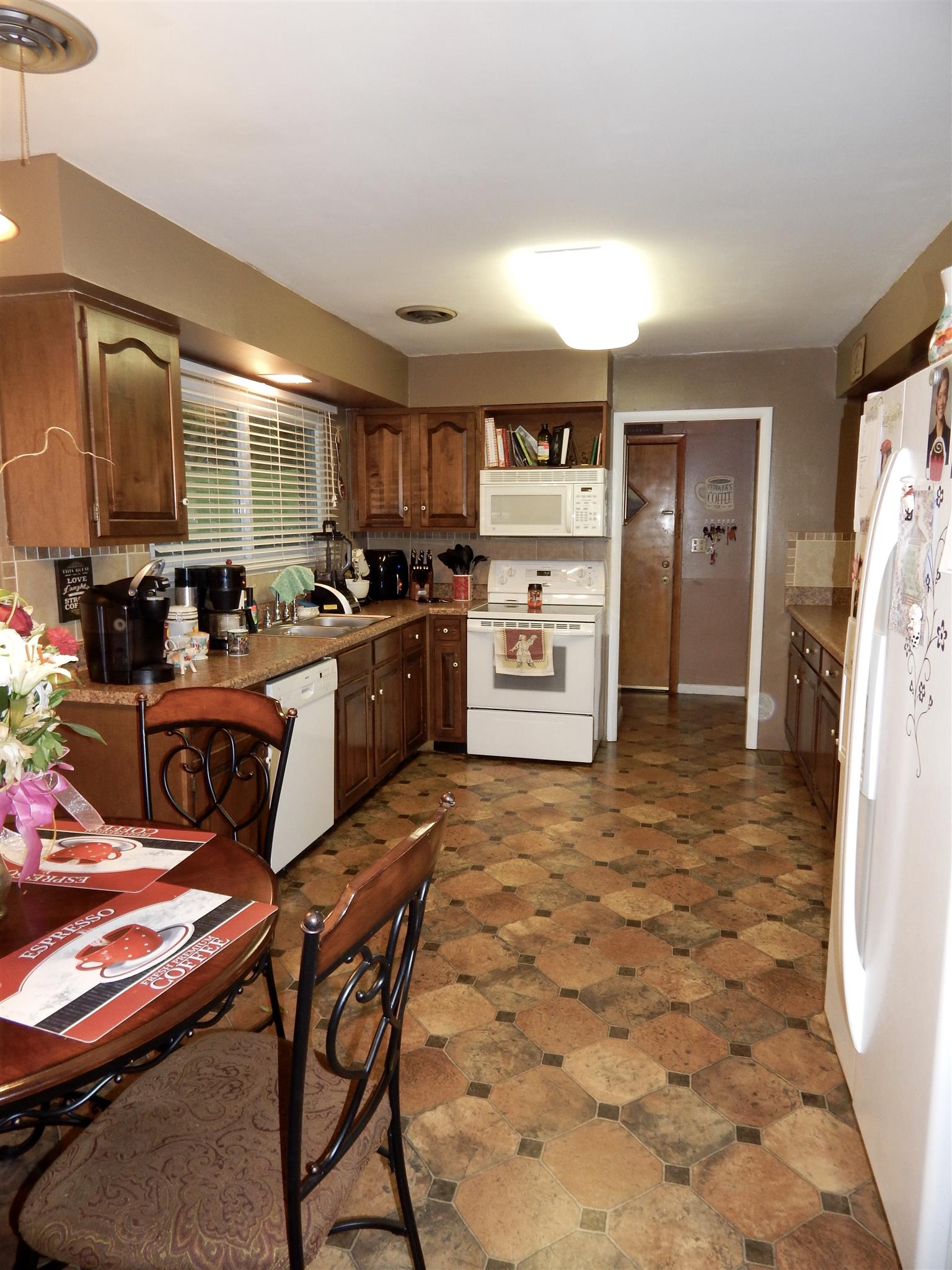 3617 Academy Road Portland, TN 37148 - Photo 9 of 27 a kitchen with a stove a refrigerator and a sink
