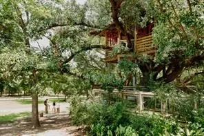 an aerial view of a house with a lake view