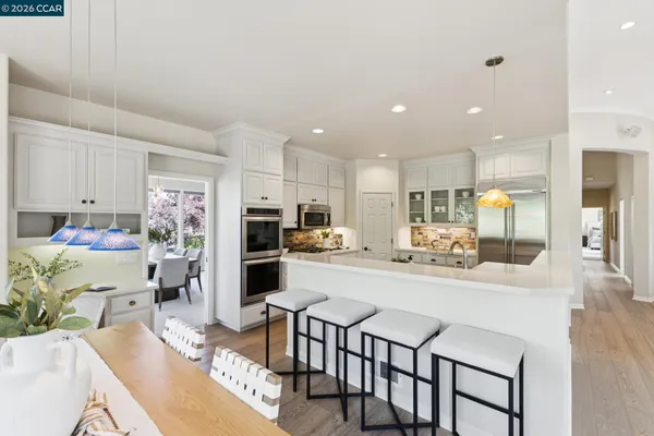 a bathroom with double sink and a mirror