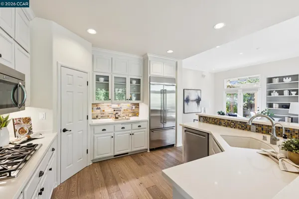 a view of a dining room with furniture and a potted plant