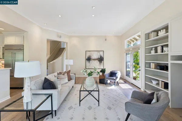 a spacious bathroom with a granite countertop sink and a mirror