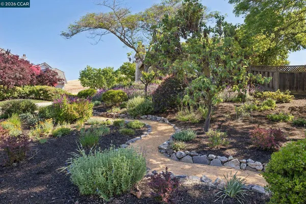 a living room with furniture and large windows