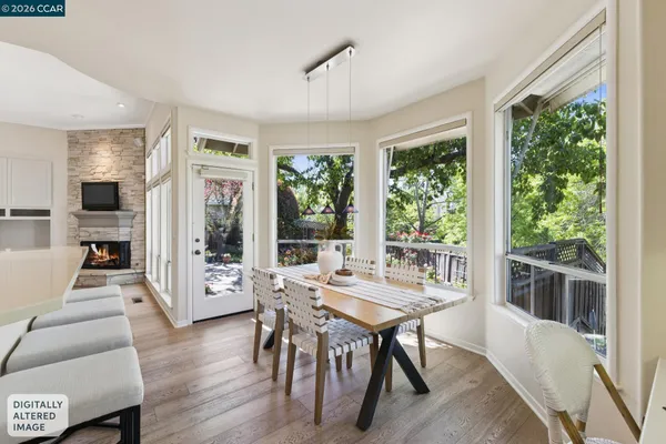a en suite bathroom with a granite countertop sink and a mirror