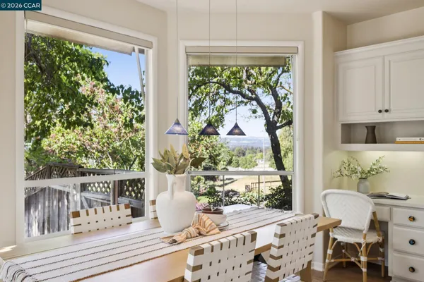 a spacious bedroom with a bed and a large window