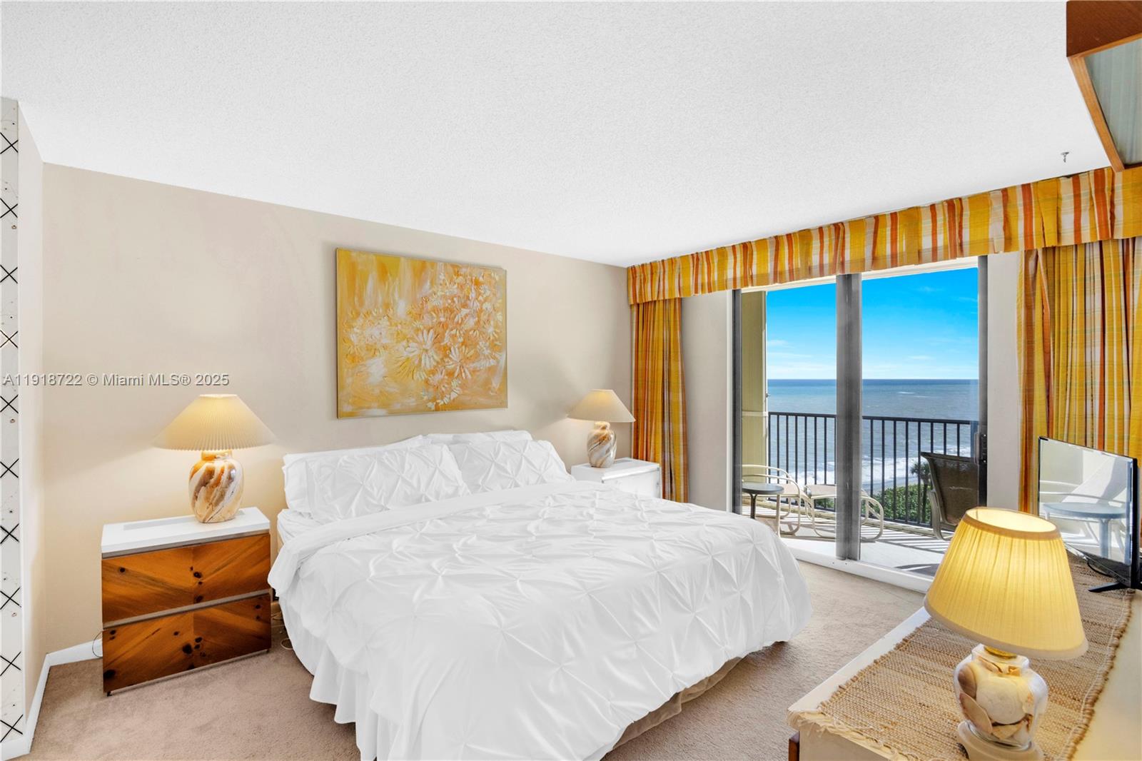 200 Ocean Trail Way, Unit 609 Jupiter, FL 33477 - Photo 11 of 27 a bedroom with a bed and a night stand