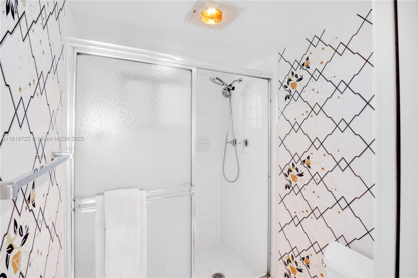 200 Ocean Trail Way, Unit 609 Jupiter, FL 33477 - Photo 14 of 27 a bathroom with a shower and a shower curtain