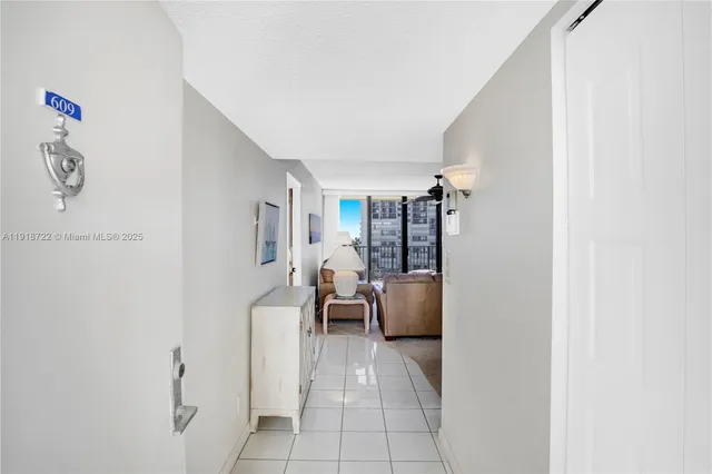 a bathroom with a granite countertop sink a toilet a shower and a mirror