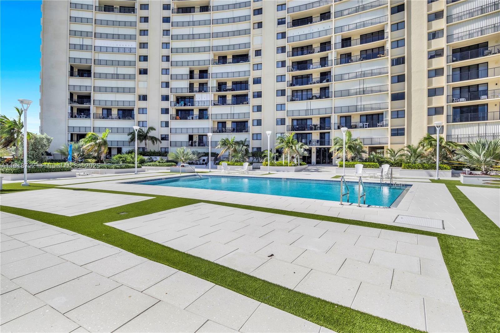 200 Ocean Trail Way, Unit 609 Jupiter, FL 33477 - Photo 20 of 27 a view of building with yard and swimming pool