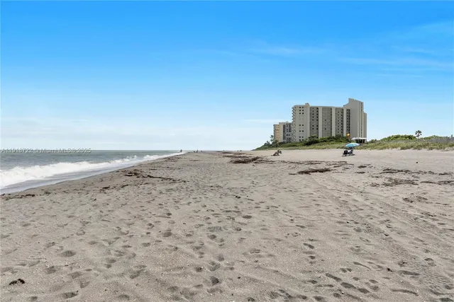 a view of a lake with a building in the background