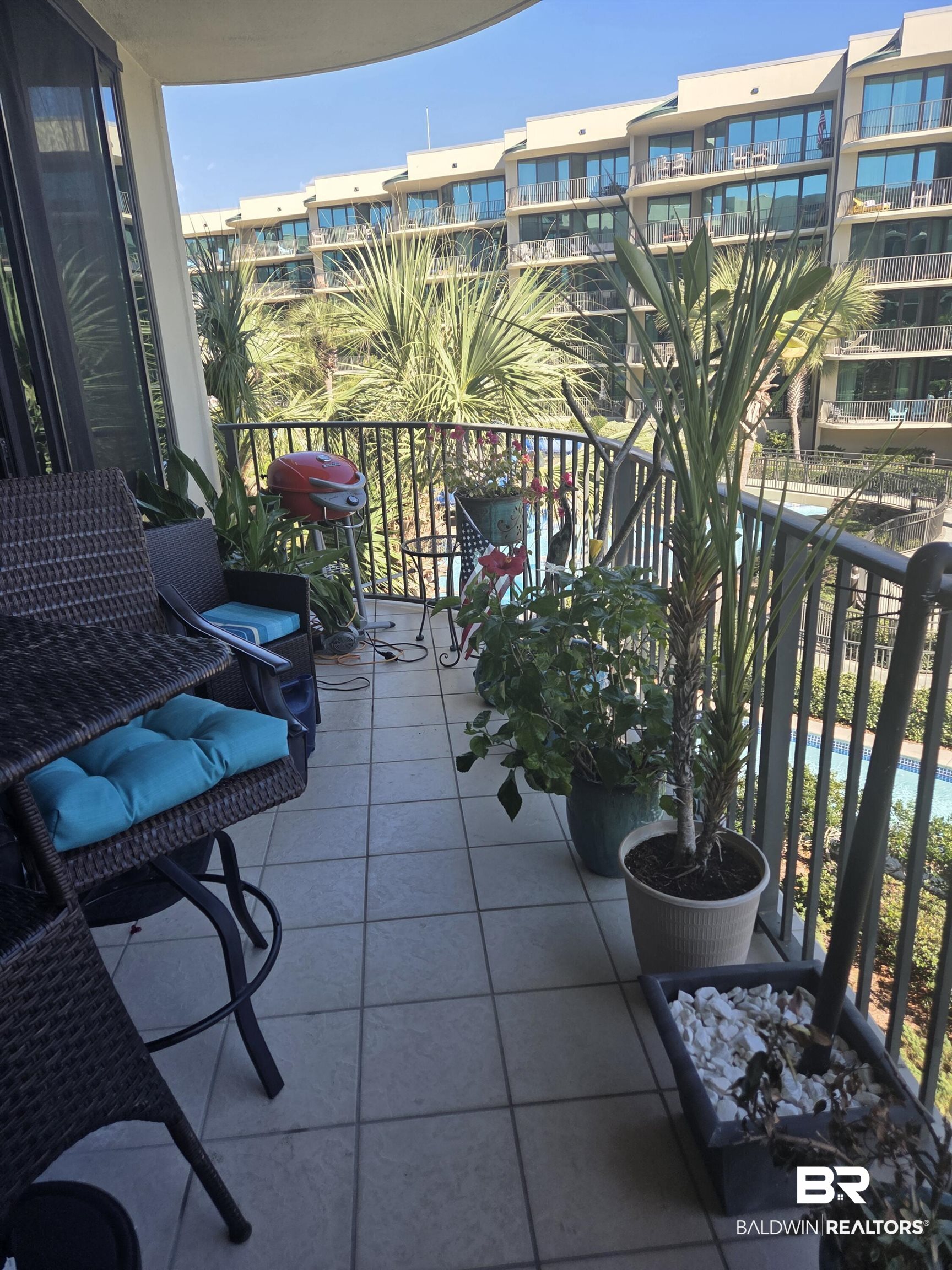 27580 Canal Road, Unit 1210 Orange Beach, AL 36561 - Photo 28 of 28 Balcony featuring view of pool area and grilling area