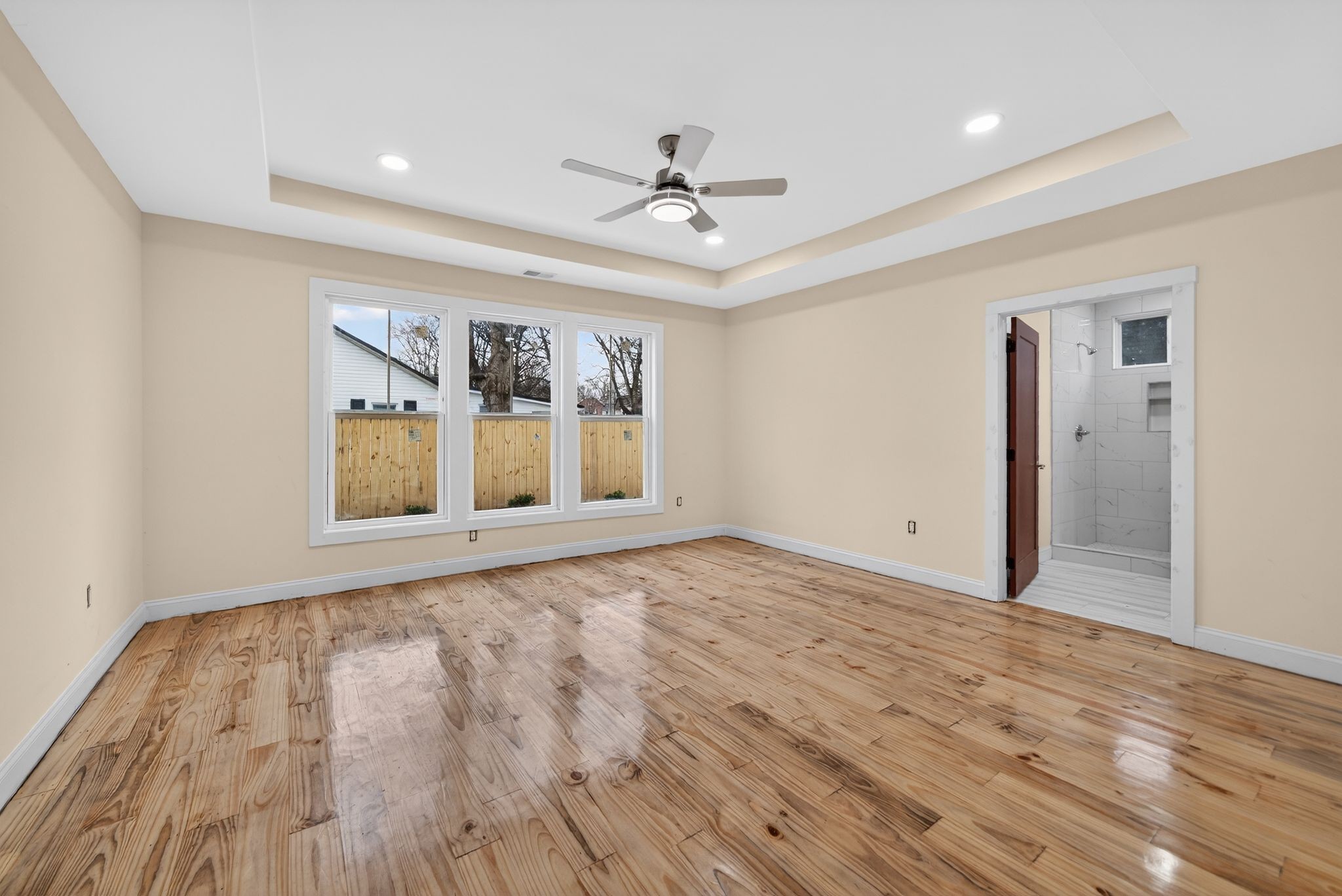 410 3rd Avenue Fayetteville, TN 37334 - Photo 22 of 49 a view of an empty room with a window and wooden floor