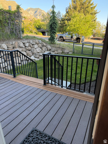 4536 North 475 East Provo, UT 84604 - Photo 52 of 65 Multi-tone composite decking with black metal railings and a stone retaining wall