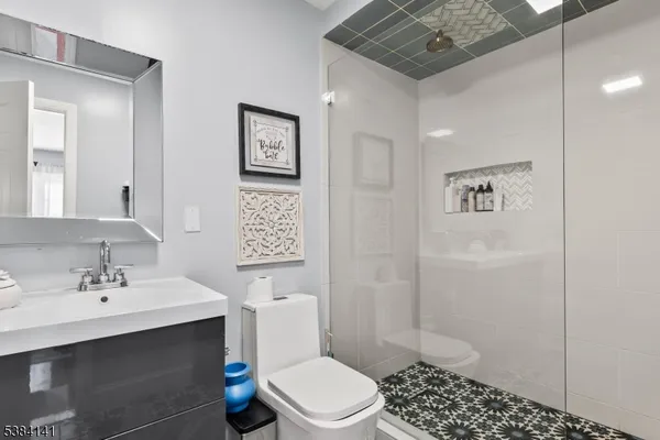 a bathroom with a sink toilet and shower