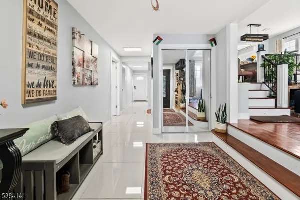 a living room with a rug and a rug