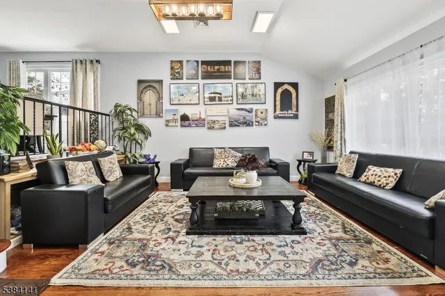 a living room with furniture and a rug